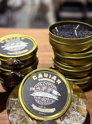 Caviar candle opened with caviar key revealing glossy gel-wax beads, playful bar cart and party decor — Wren Supply Co.