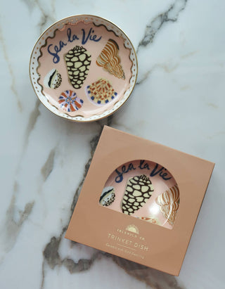 Sea La Vie porcelain trinket dish beside its Idlewild Co. plastic-free window gift box labeled Trinket Dish, Ceramic with Gold Detailing