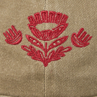 Close-up of red folk floral embroidery on tan cotton baseball cap — Wren Supply Co.