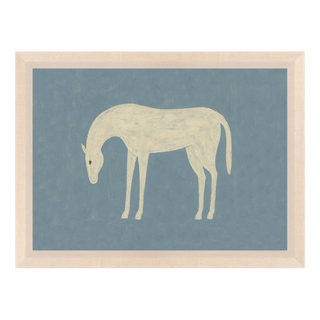 Folk-art white horse with bowed head on dusty blue, in a blonde wood 15x11 frame for a collected European-inspired room.