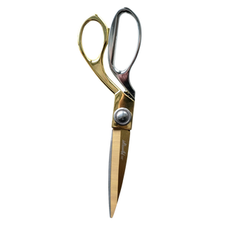 Gold-handled scissors with a silver blade on a white background